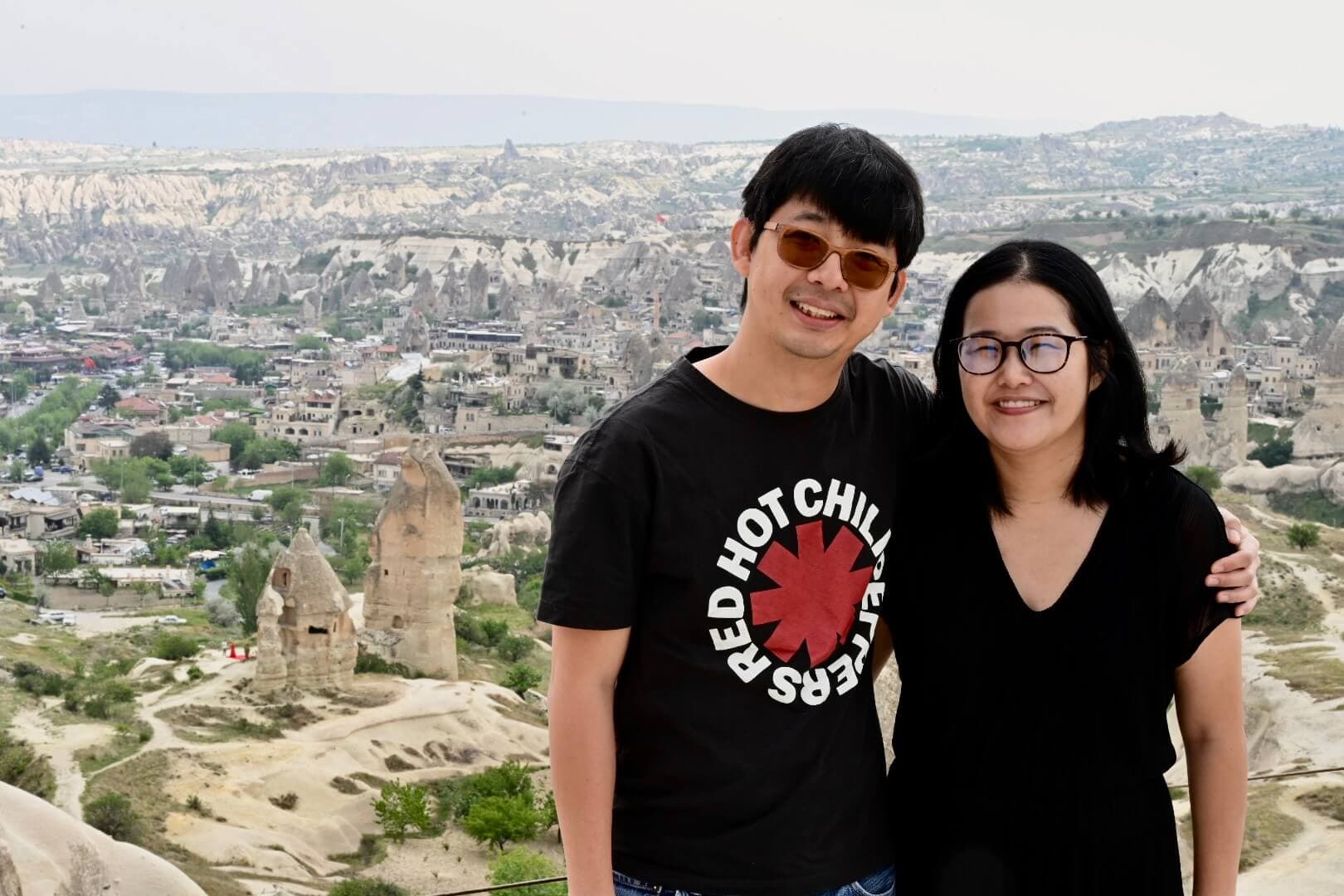 Couple photo in Cappadocia, Turkey with the dramatic landscape behind
